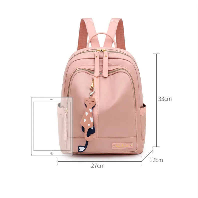 Women's black nylon backpack with waterproof lining and multiple zippered compartments