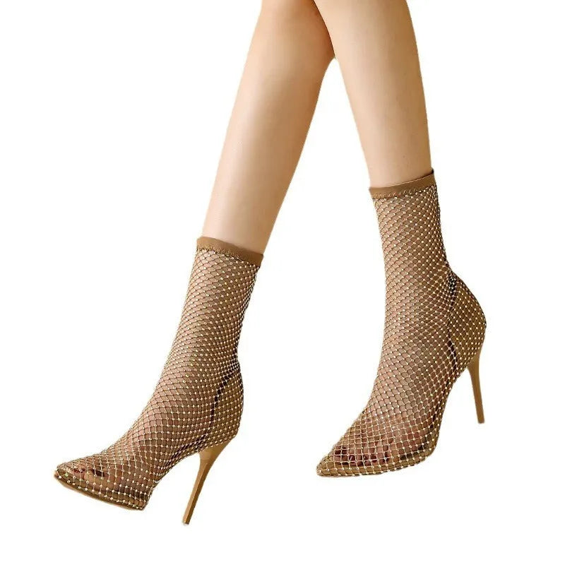 Gold mesh pointed toe stiletto high heel sandals with an oversleeves design on a rubber sole.