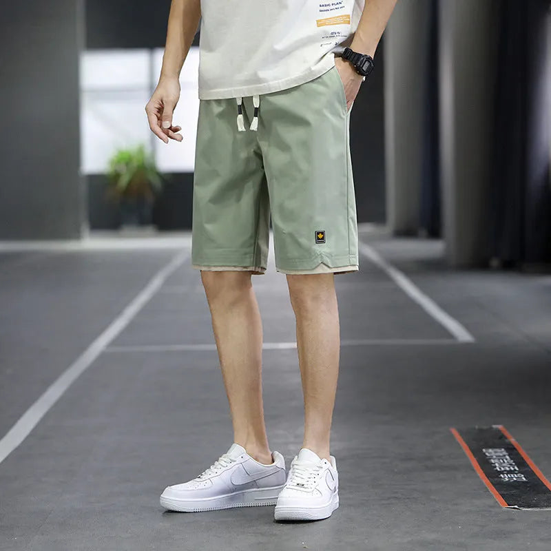 Men's loose-fit Korean-style casual beach shorts in blue, available in sizes up to 8XL.