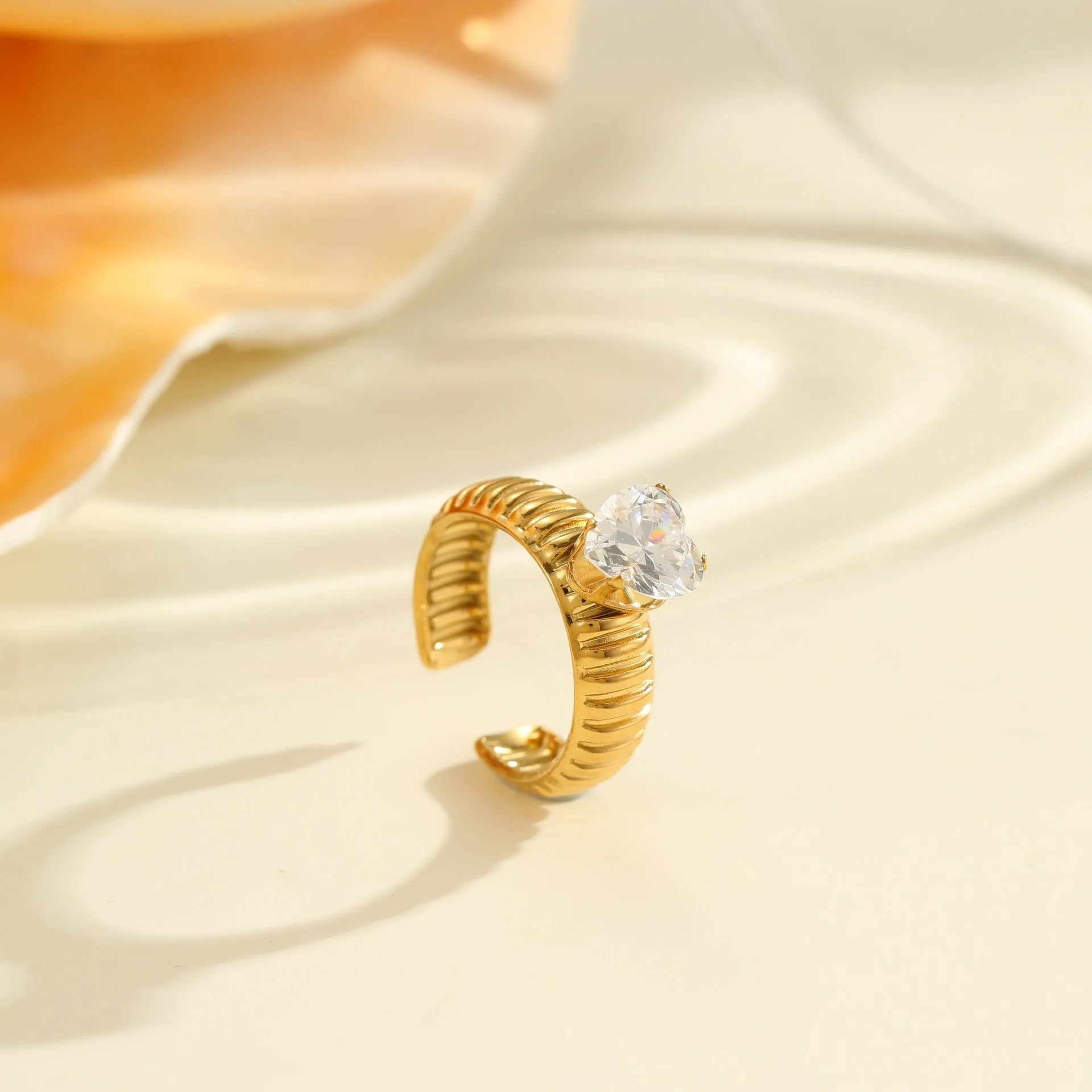 Gold electroplated stainless steel ring with zircon geometric design and open mouth adjustable fit
