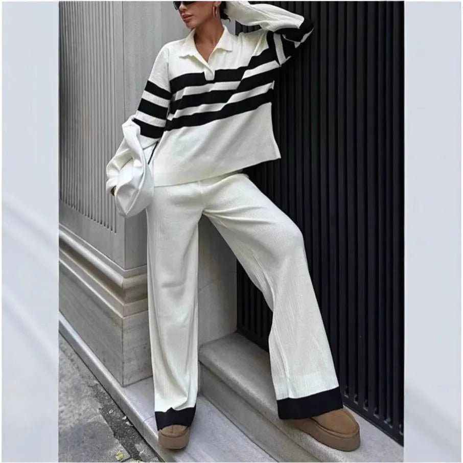 Women's black knitted two-piece set with polo collar shirt and striped matching trousers