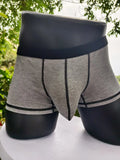 Solid-colour men's boxers in breathable fibre fabric on a size chart.