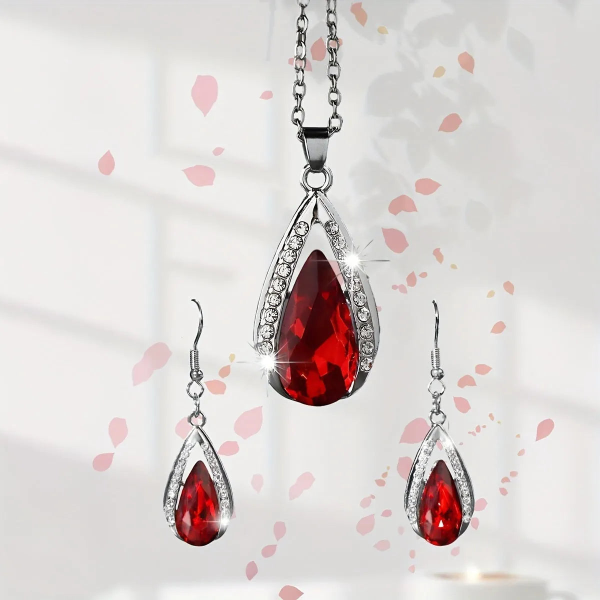 Black and red alloy necklace and earrings set with teardrop glass pendants