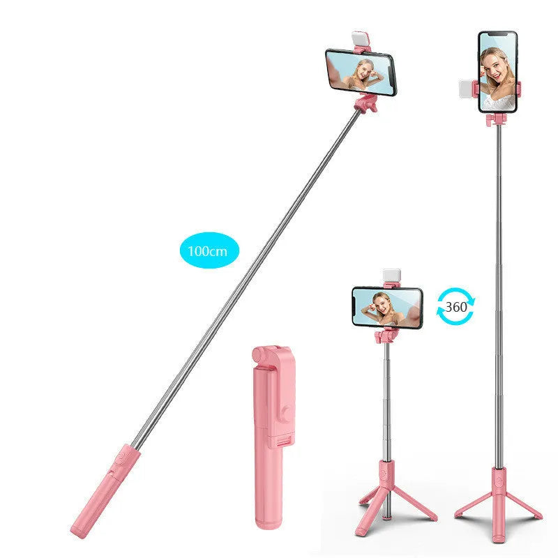 Black aluminium alloy Bluetooth selfie stick with extended tripod legs and a phone attached to the 360-degree rotating holder.