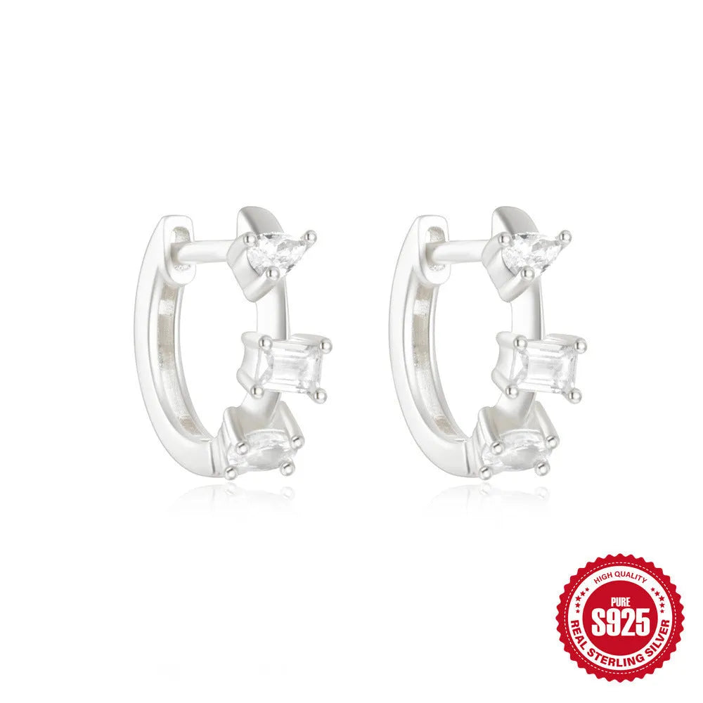 Sterling silver geometric stud earrings with small round diamond detailing in gold and silver electroplated finishes