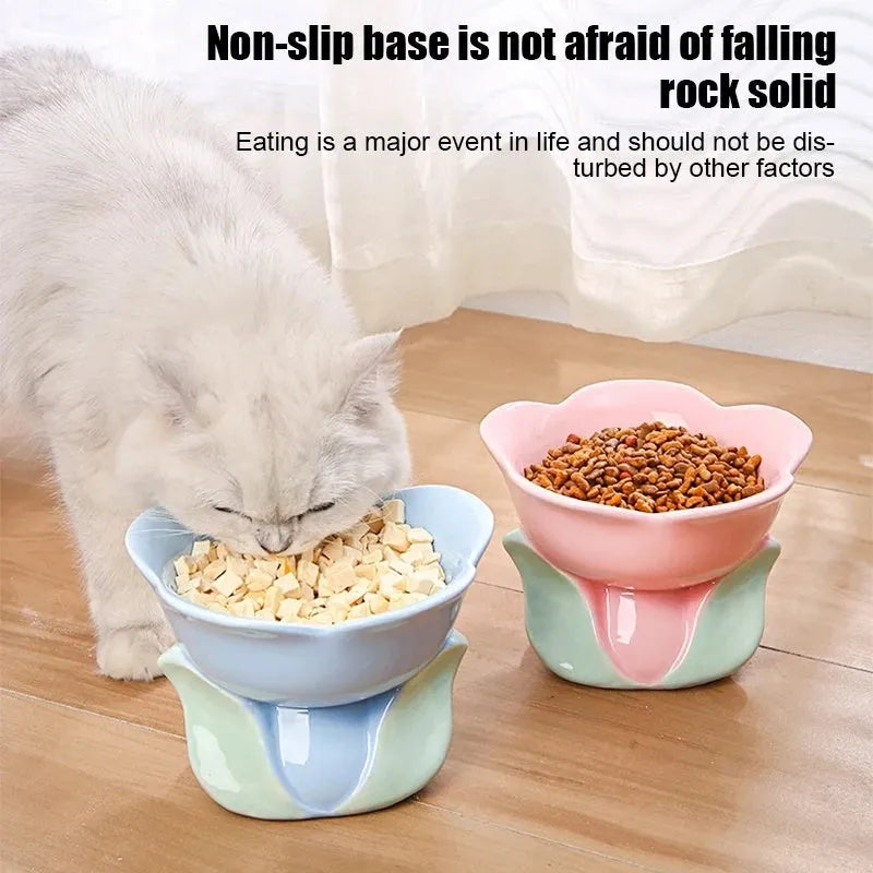 Blue ceramic elevated pet bowl with floral pattern for cats and small dogs on a non-slip base.
