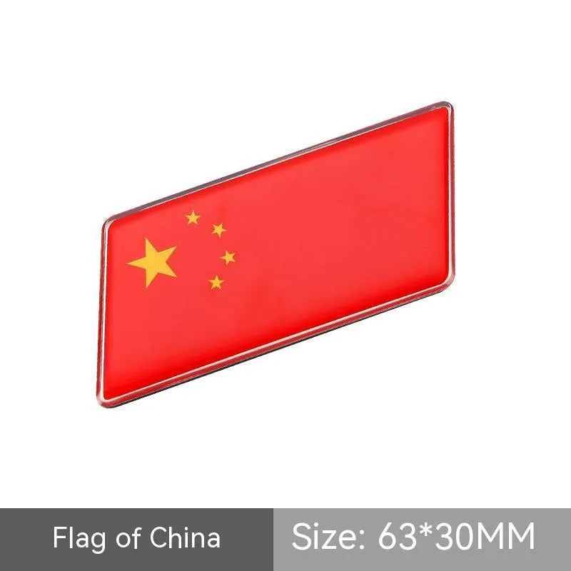 Aluminium parallelogram car sticker with national flag design measuring 6.3 by 3 cm