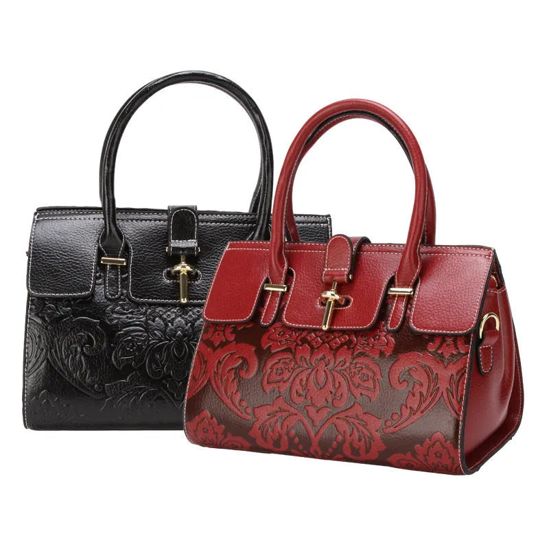 Red genuine leather oval crossbody bag with embossed design and multiple interior pockets