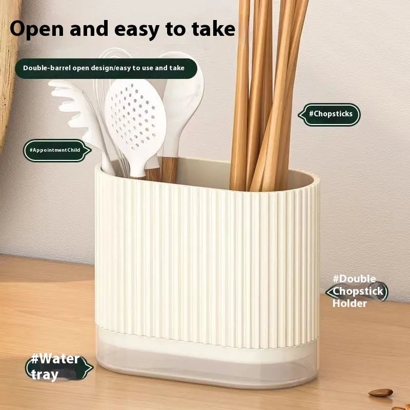 Plastic wall-mounted chopstick and spoon holder tube with drainage holes in beige colour.