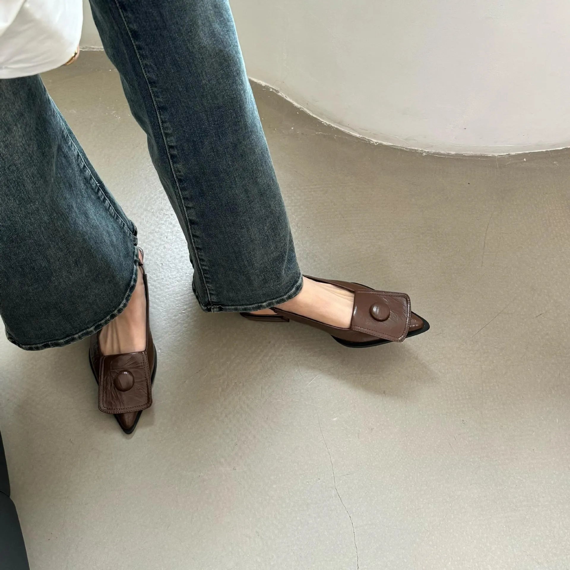 Women's low heel pointed toe sandals with back strap in apricot, black, brown, and silver colours.