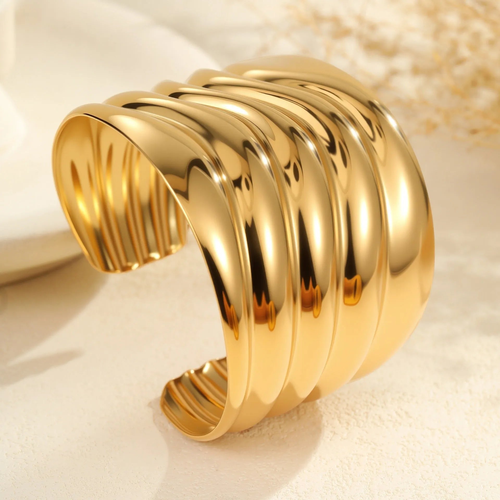 Women's 18K gold plated stainless steel bracelet with exaggerated wide wave geometric design