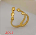 Adjustable brass opening ring with spherical design in gold or silver colour