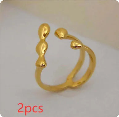 Adjustable brass opening ring with spherical design in gold or silver colour