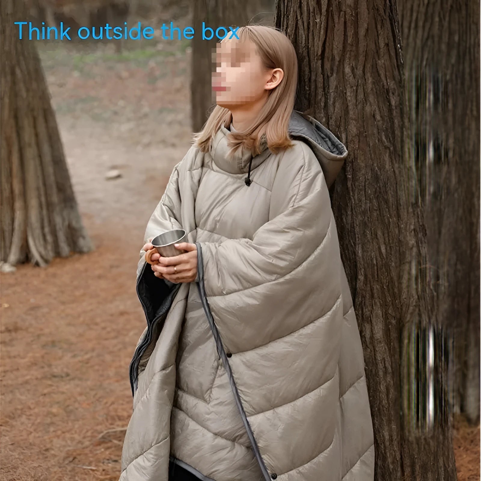 Grey outdoor cloak sleeping bag with hood showing transformation to wearable cape