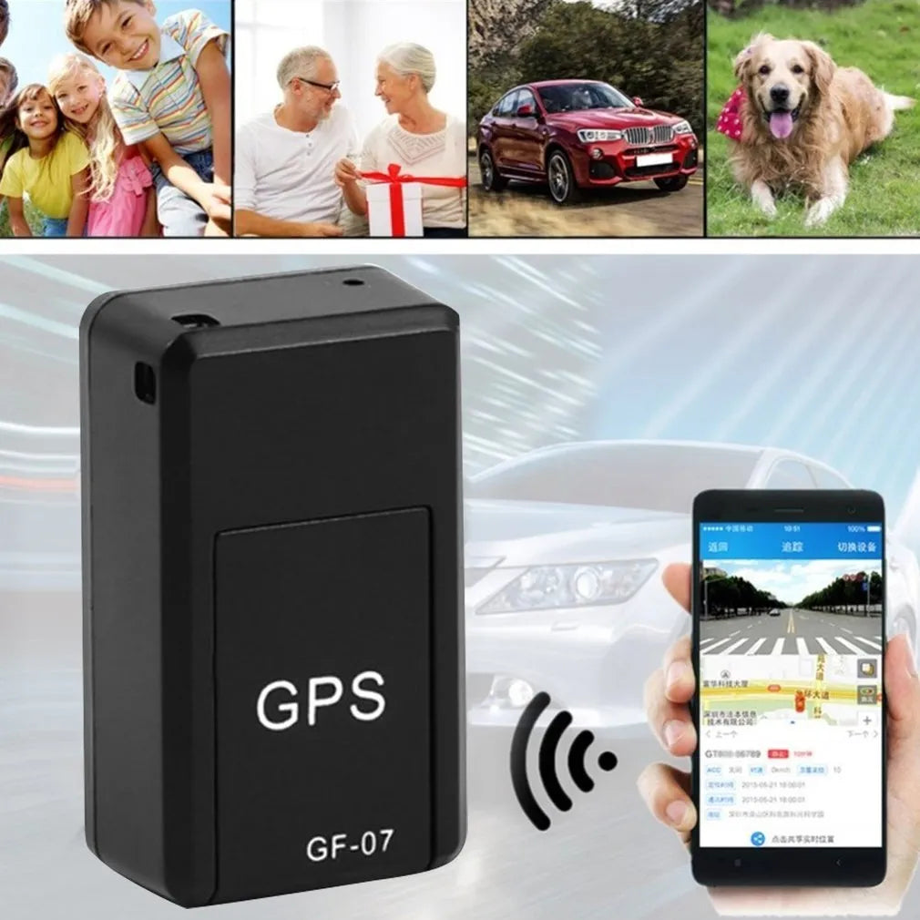 Small black plastic magnetic GPS car tracker device on a metal surface.