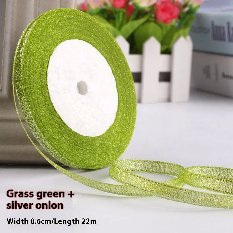Roll of polyester gift ribbon showing 0.6cm width and multiple colour options including metallic finishes