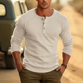 Men's white Henry collar long sleeve T-shirt with cotton blend fabric on hanger