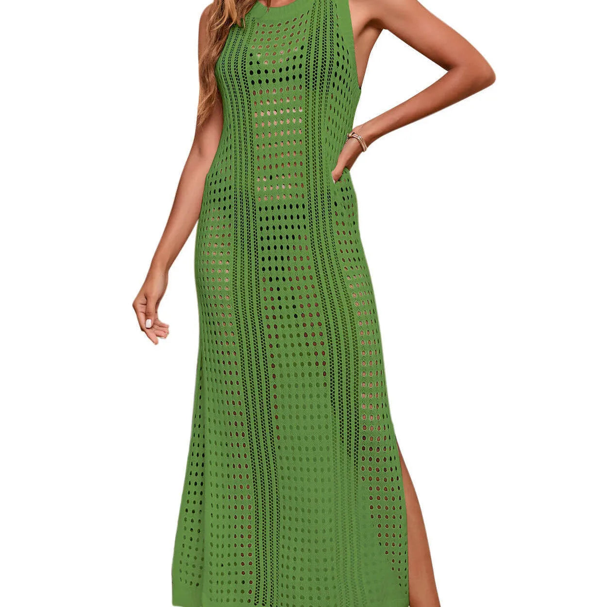Long loose green hollow-out knitted beach blouse for women on a hanger