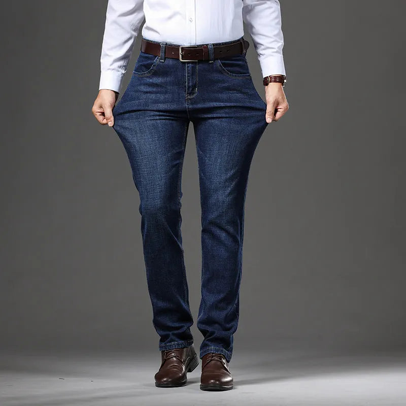 Men's black straight-leg stretch jeans with mid-waist and zip closure on plus size model