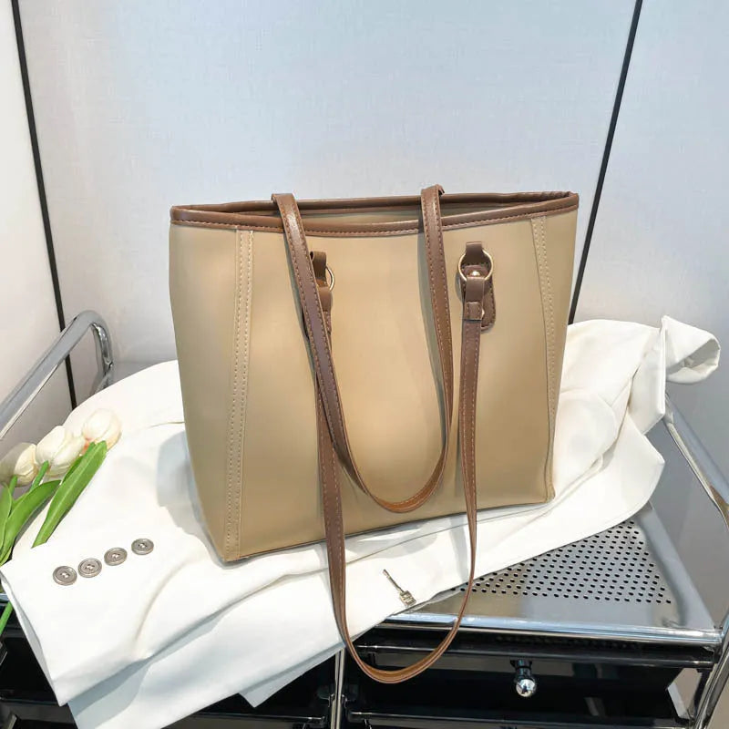 PU leather tote bag with contrast colour trim and internal mobile phone and document compartments