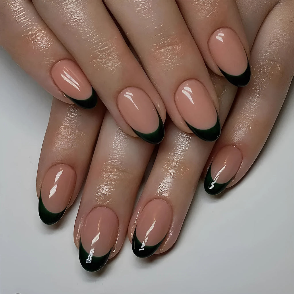 24 black French style acrylic false nails with short almond shape laid out on a surface.