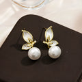 A pair of zircon butterfly earrings for women with a copper base and electroplated finish, style PT0203.