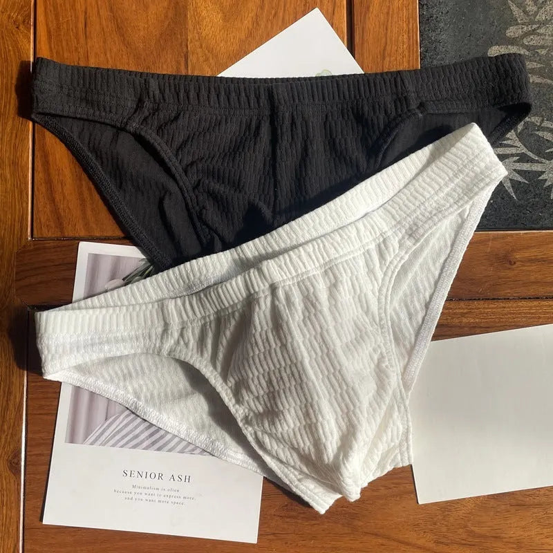 Men's solid colour cotton triangle underwear briefs with mid waistband, shown in apricot black colour.