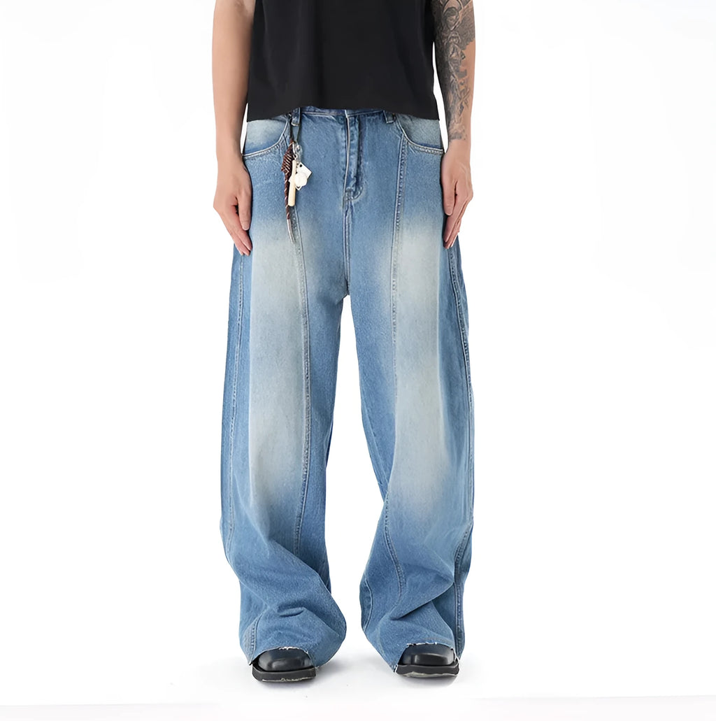 Light blue vintage washed wide leg machete jeans with a straight fit and zipper fly on a model.