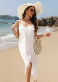 White crocheted beach dress for women with hollow weave and bottom slit design.
