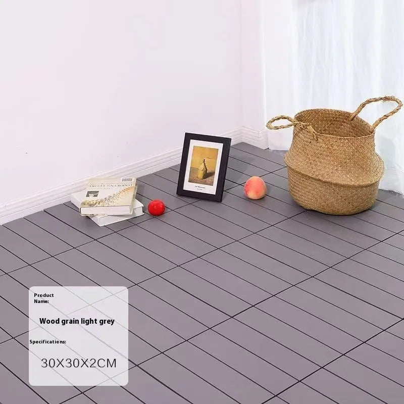 Ten square plastic floor tiles with a wood grain pattern, showing a non-slip surface.