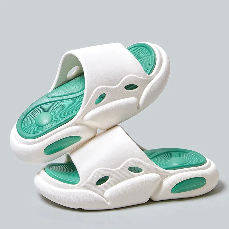 Women's and men's two-colour thick-soled EVA slippers with leather lining on a beach