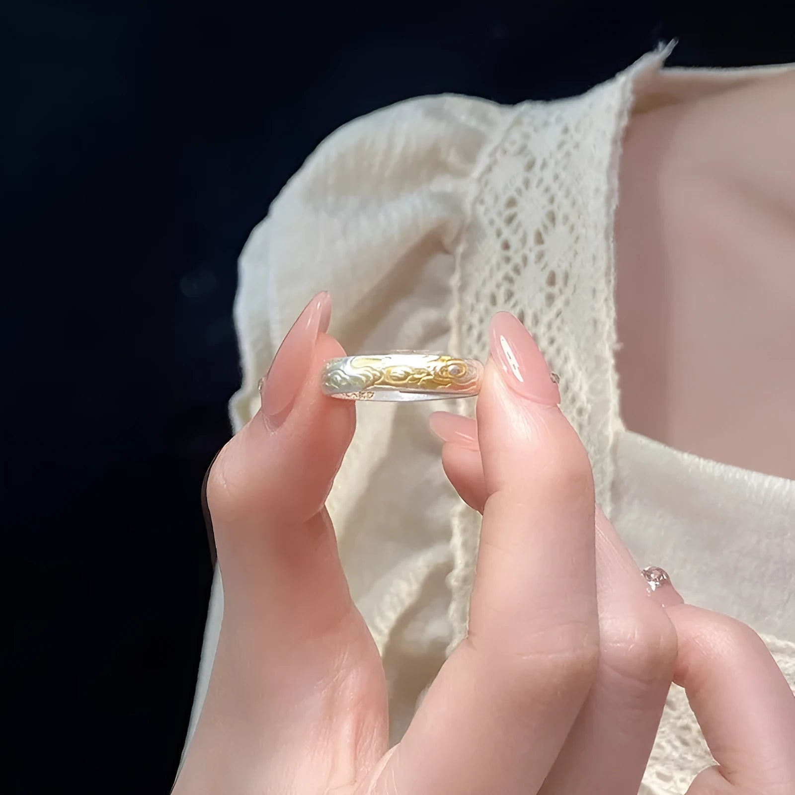 Open mouth silver and gold ring with a geometric Xiangyun pattern on a white copper band.