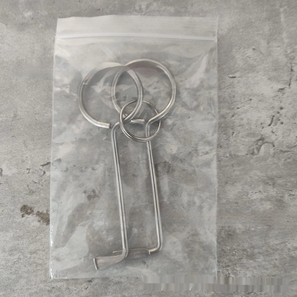 Two alloy steel wrench tools from a portable household repair set.