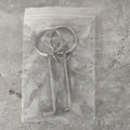 Two alloy steel wrench tools from a portable household repair set.