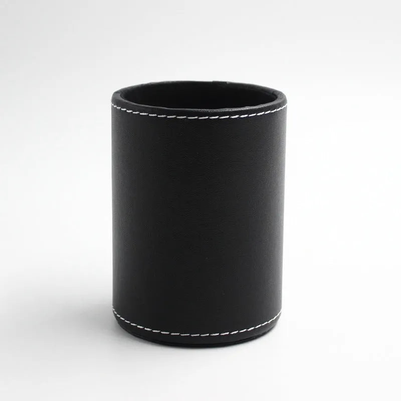 Round black leather pen container measuring 8.0cm diameter and 10.8cm height