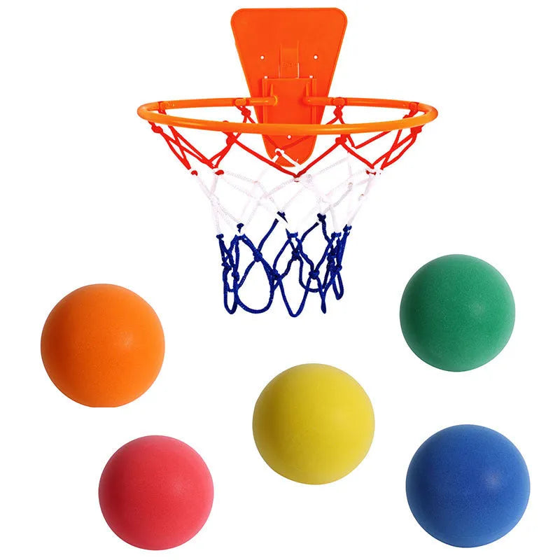 Silent foam basketball training ball in assorted bright colours with basketball hoop