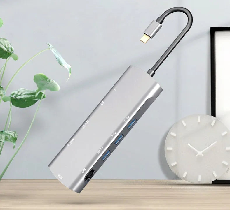 Grey aluminium USB-C docking station with HDMI, VGA, USB and charging ports