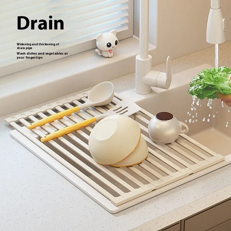 Foldable stainless steel kitchen draining rack in milky white finish showing tri-fold mechanism