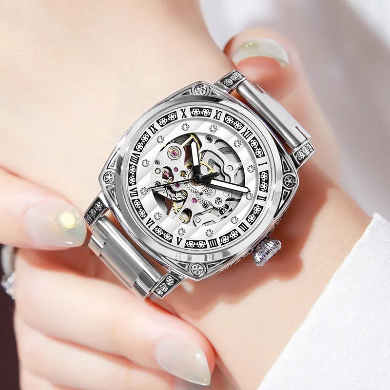Mechanical watch with luminous hands on a leather strap, stainless steel case, shown in black colour.