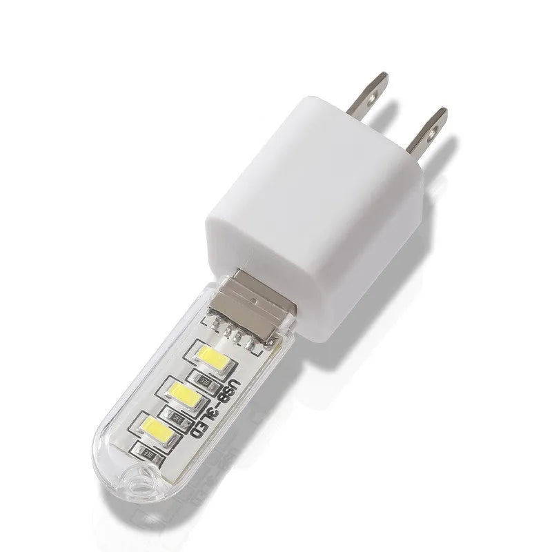 Small white USB-powered LED night light showing warm and cool white light options