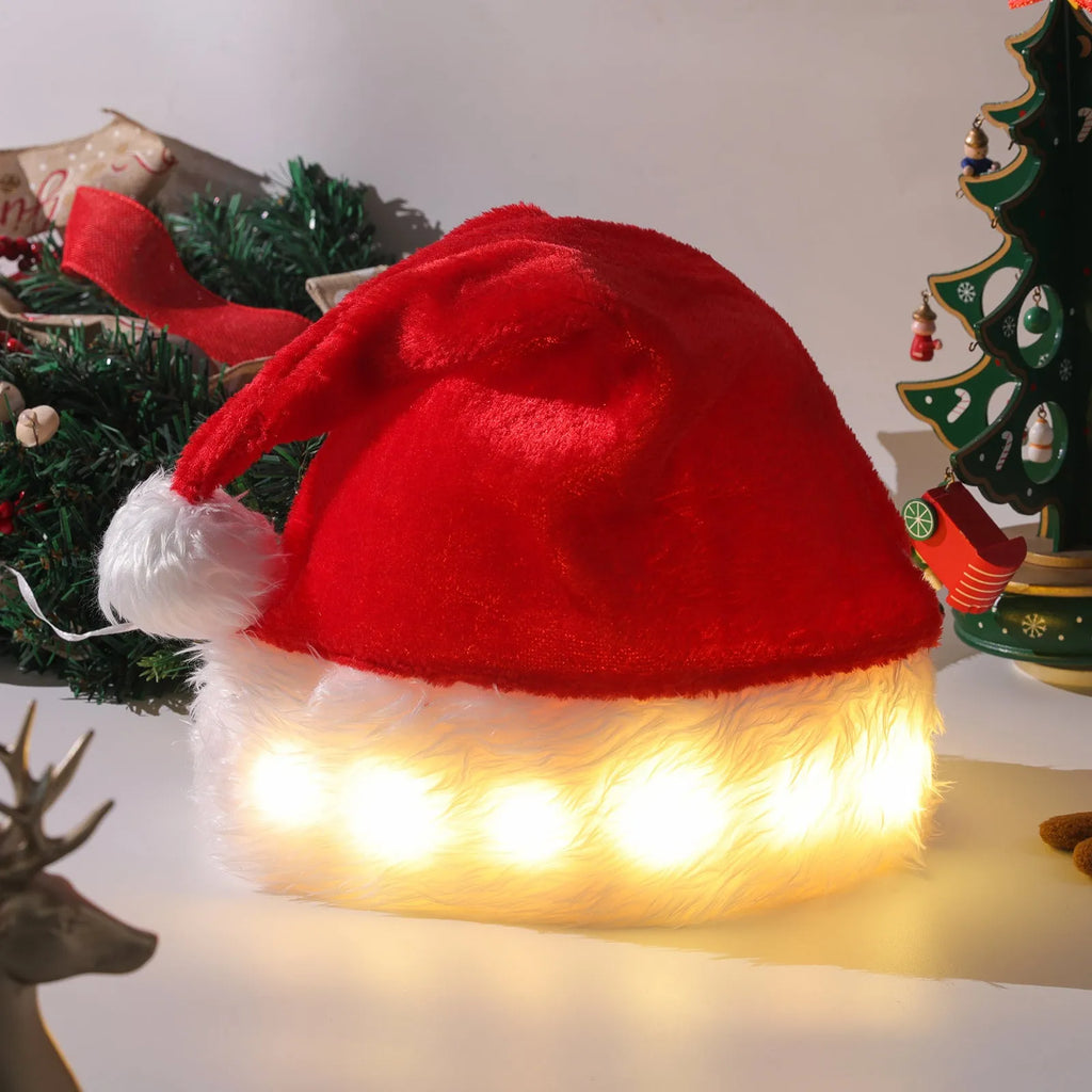 Red and white plush LED Santa hat with pom-pom and multi-coloured twinkling lights on.
