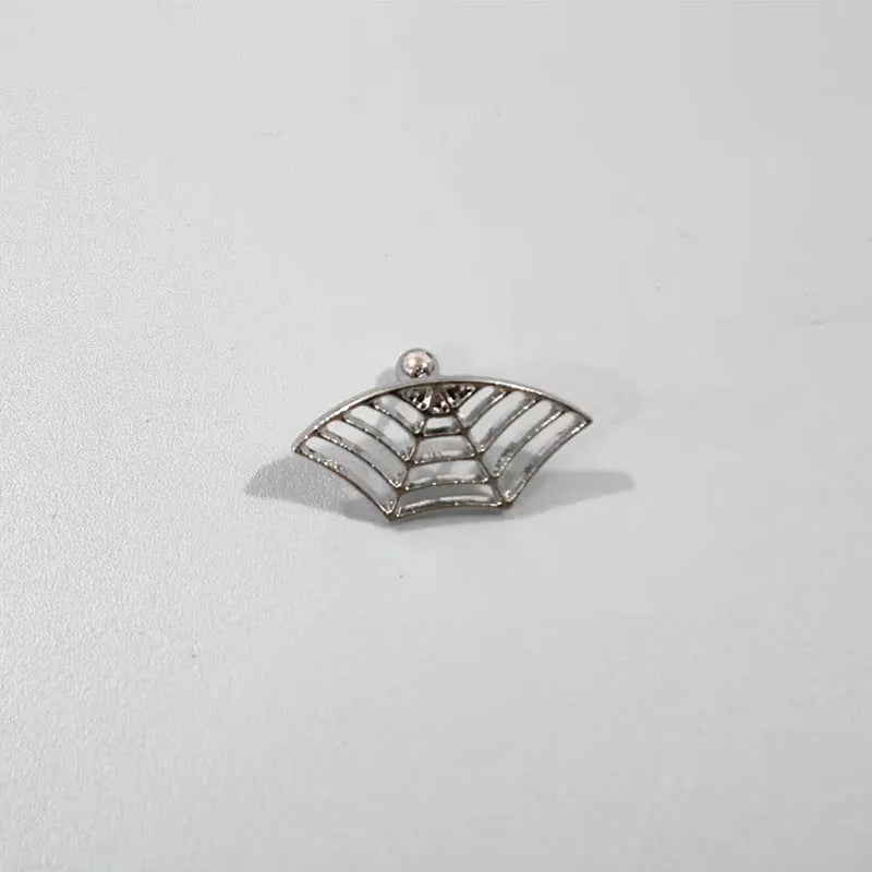 A pair of geometric spider web design stud earrings in an electroplated gold finish.