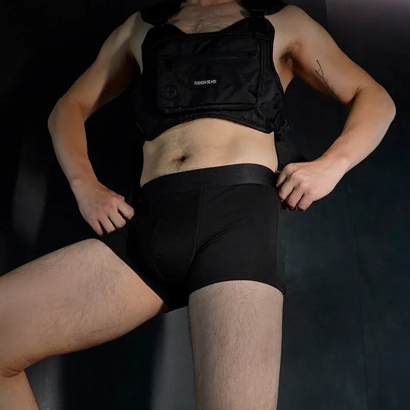 Men's solid colour cotton boxers in black, white, silver grey, and light green laid flat