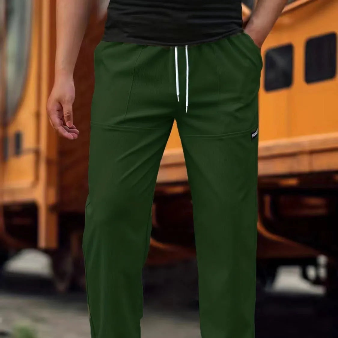 Men's light grey polyester trousers for spring and autumn casual wear, shown in Asian sizing.