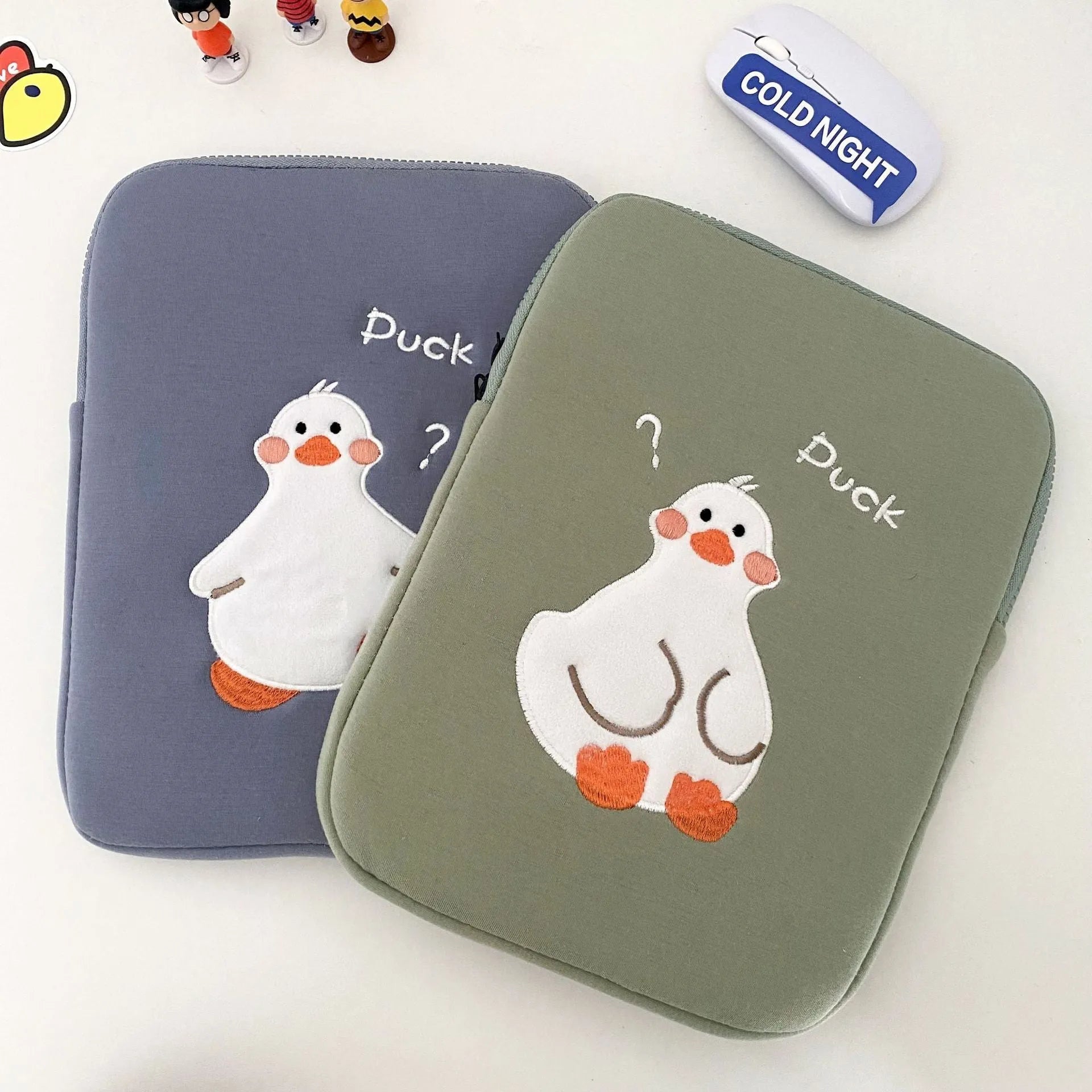 Blue tablet case with cartoon duck embroidery design and zipper closure