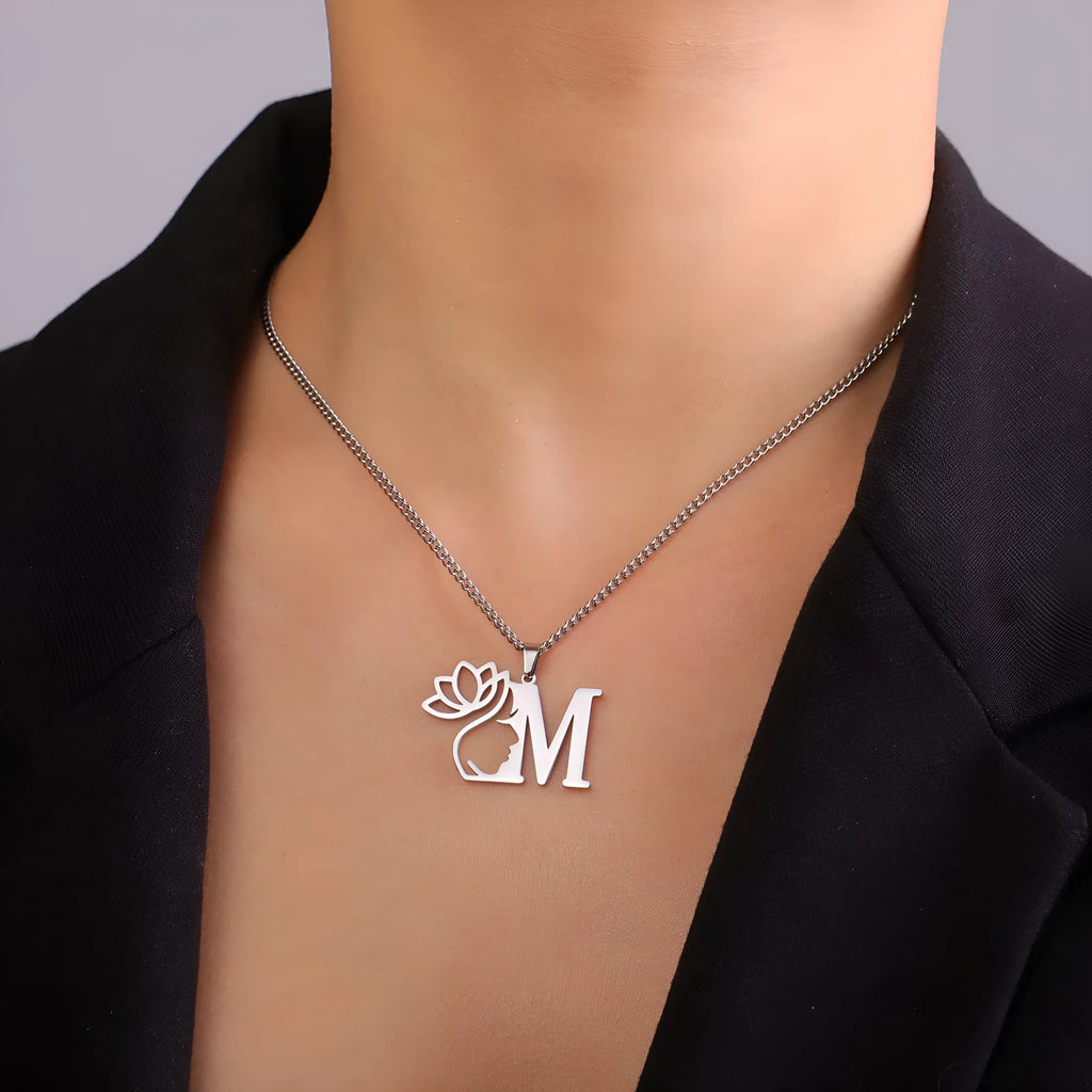 Stainless steel necklace with cross chain and a single letter pendant in gold or silver finish.