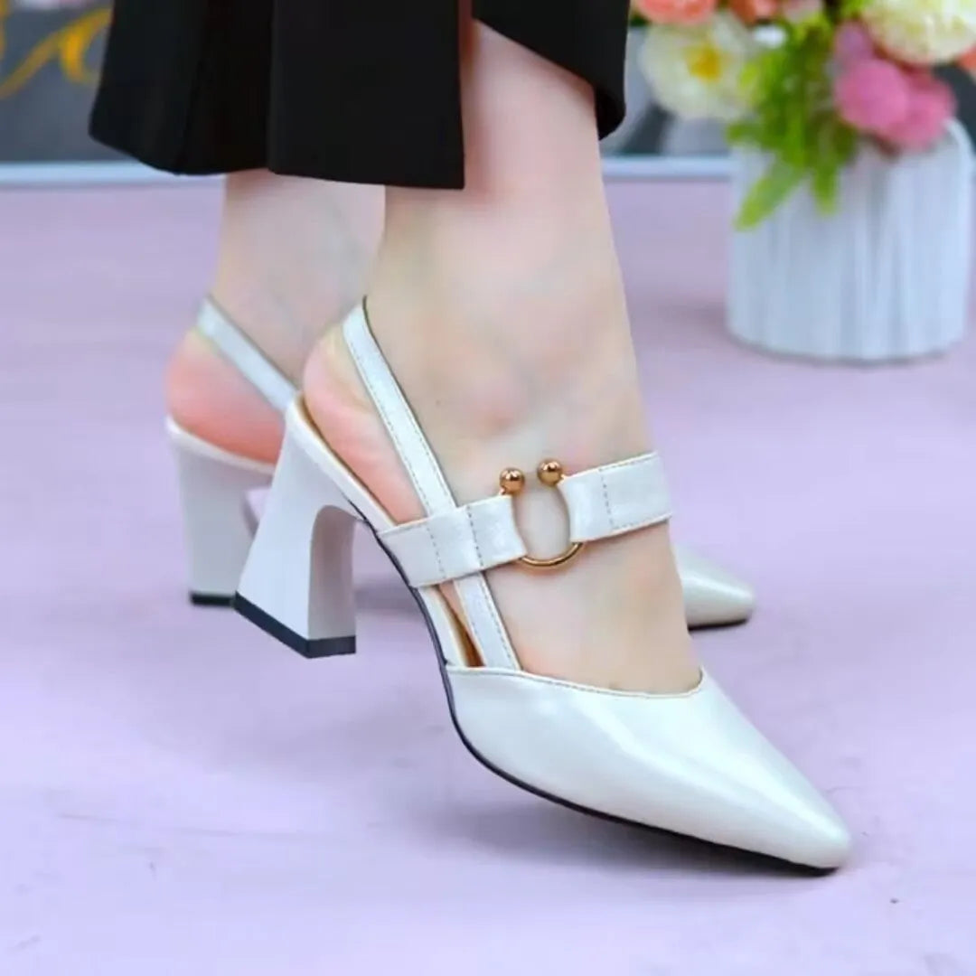 Women's apricot closed toe backless leather sandals with a chunky heel on a rubber sole.