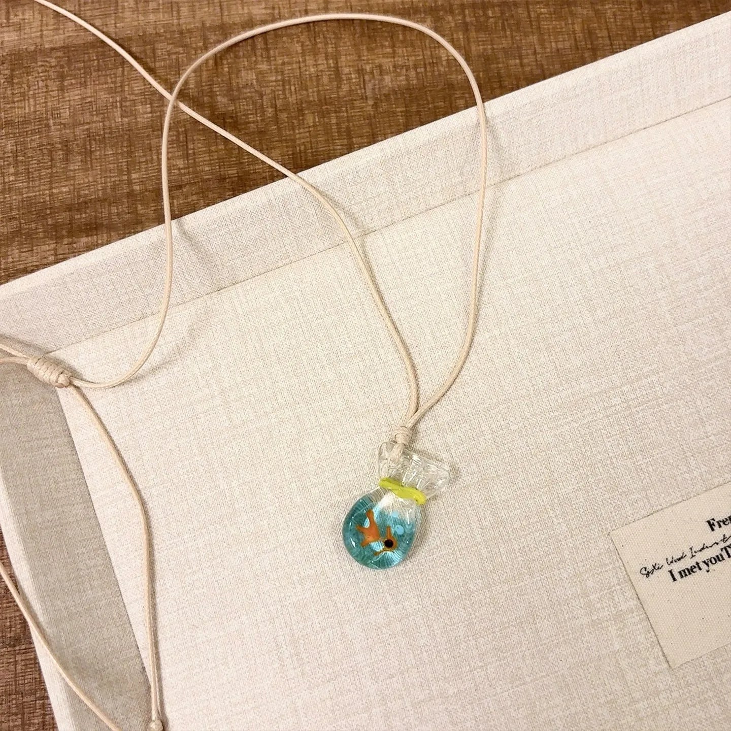 Women's pendant necklace with coloured glaze skirt joker charm on cotton linen clavicle chain