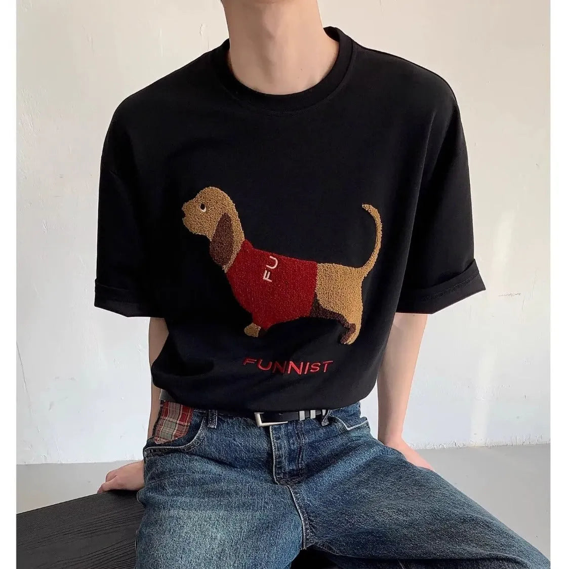 Grey men's cotton T-shirt with an embroidered cartoon dachshund holding a towel.
