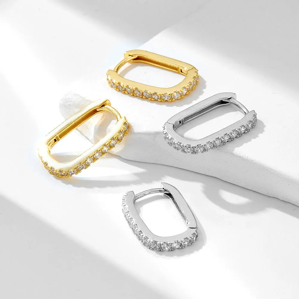 Sterling silver oval zircon ear clip earrings with geometric design in white or yellow colour